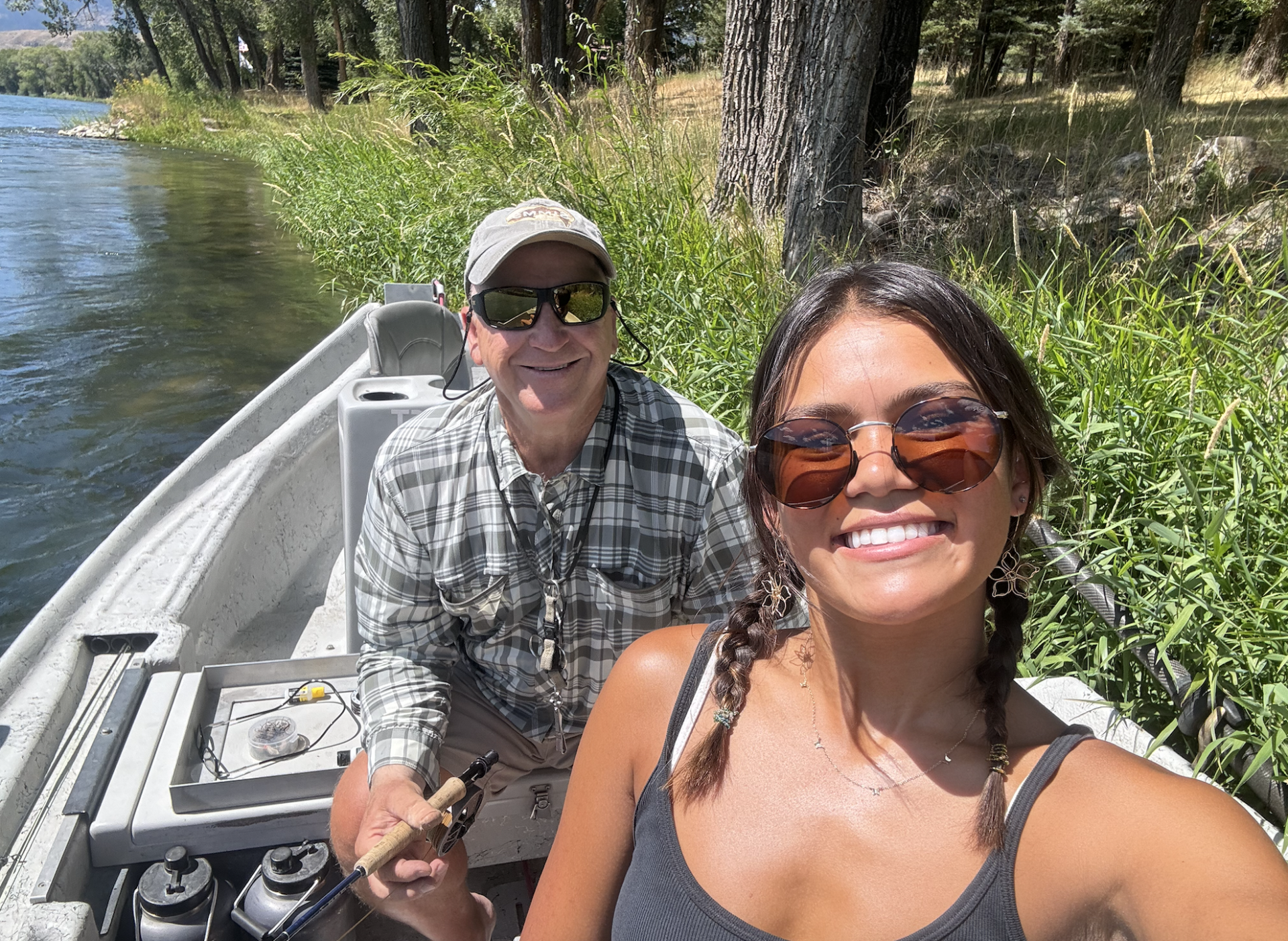 2 people in a boat on the river