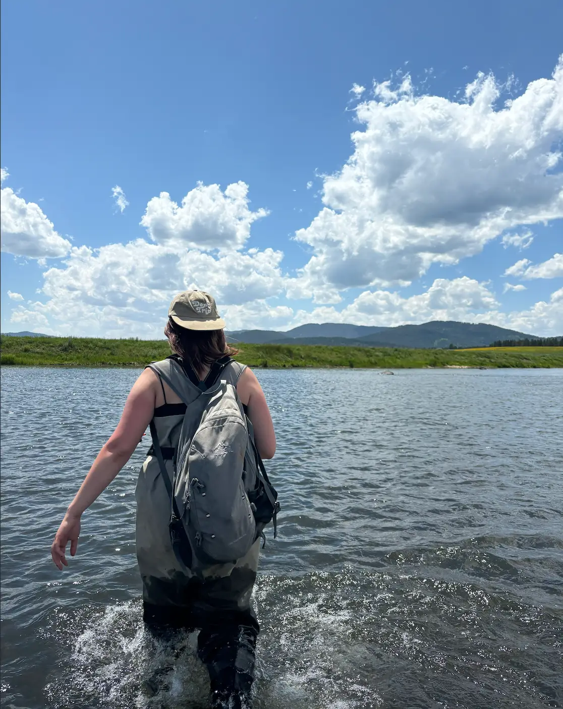 Woman wading in the river